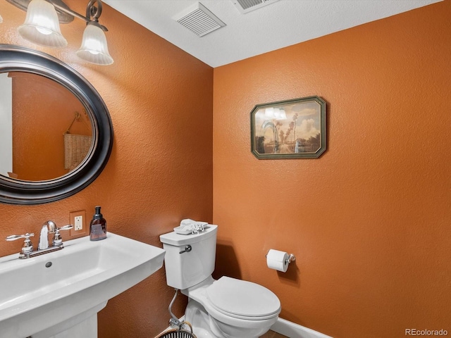 13762 W 67th Pl, Arvada, CO 80004 - half bath with a sink and a textured wall