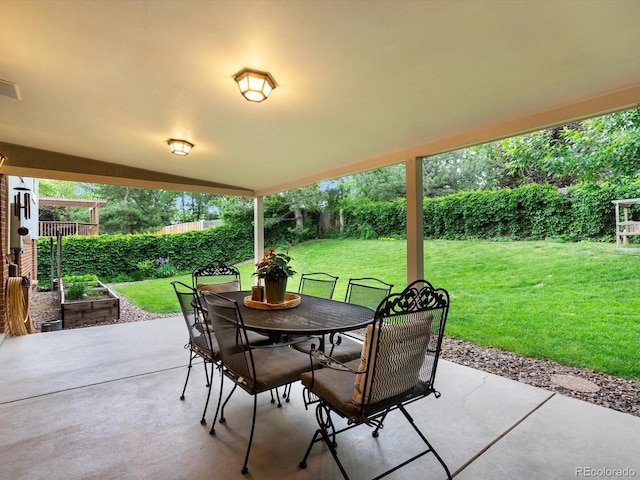 13762 W 67th Pl, Arvada, CO 80004 - fenced backyard featuring a patio and outdoor dining area