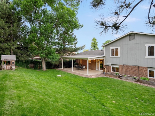 13762 W 67th Pl, Arvada, CO 80004 - view of green lawn featuring a patio