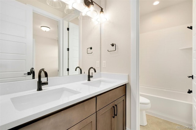 full bathroom featuring tile patterned flooring, bathtub / shower combination, vanity, and toilet