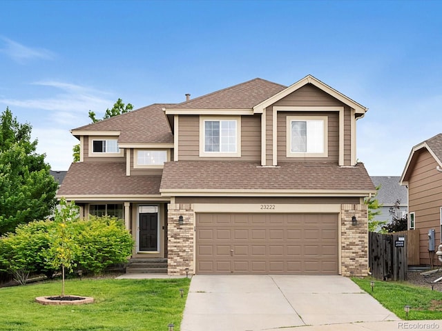 23222 E Orchard Pl, Aurora, CO 80015 - view of front of property with roof with shingles, an attached garage, driveway, and brick siding