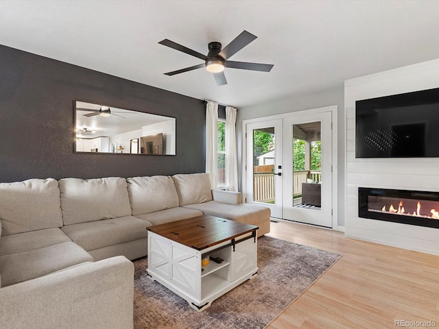 23222 E Orchard Pl, Aurora, CO 80015 - living room with ceiling fan, wood finished floors, and a glass covered fireplace