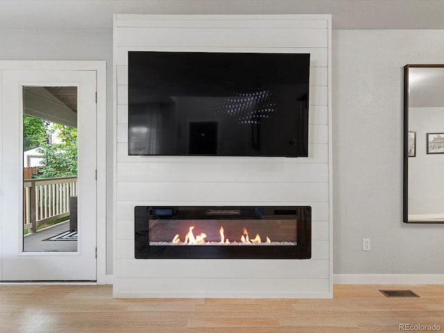 23222 E Orchard Pl, Aurora, CO 80015 - detailed view of a fireplace and wood finished floors