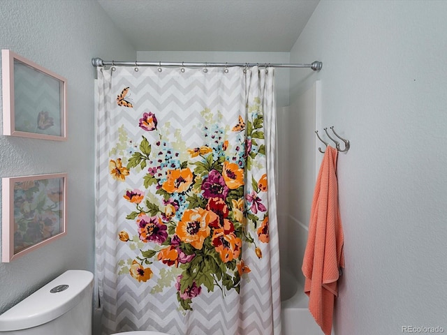 23222 E Orchard Pl, Aurora, CO 80015 - bathroom with a textured wall and shower / bathtub combination with curtain
