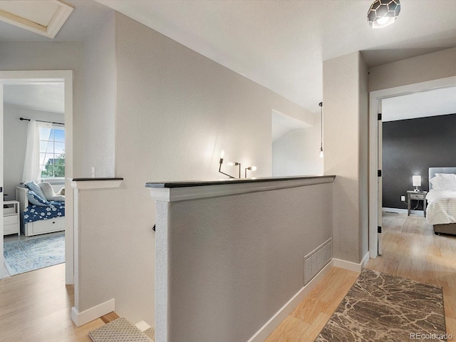 23222 E Orchard Pl, Aurora, CO 80015 - corridor featuring wood finished floors and an upstairs landing