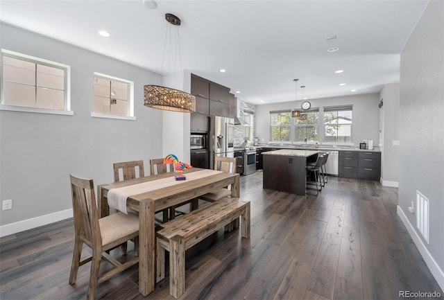 2592 S Norse Ct, Lakewood, CO 80228 - dining room featuring recessed lighting, dark wood-style flooring, baseboards, and visible vents