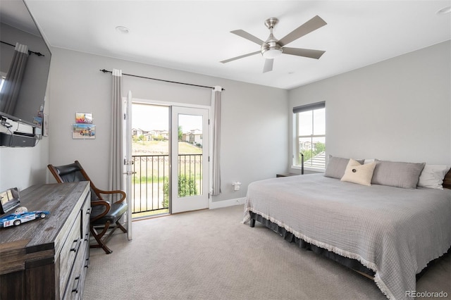2592 S Norse Ct, Lakewood, CO 80228 - bedroom with multiple windows, ceiling fan, access to outside, and light colored carpet