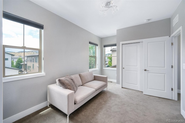 2592 S Norse Ct, Lakewood, CO 80228 - living area featuring light carpet and baseboards
