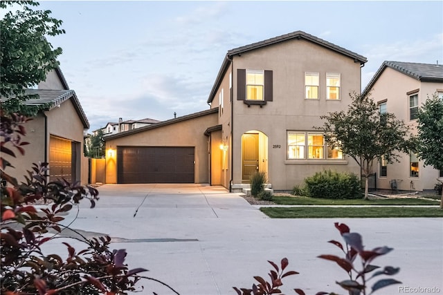 2592 S Norse Ct, Lakewood, CO 80228 - traditional home with an attached garage, driveway, and stucco siding