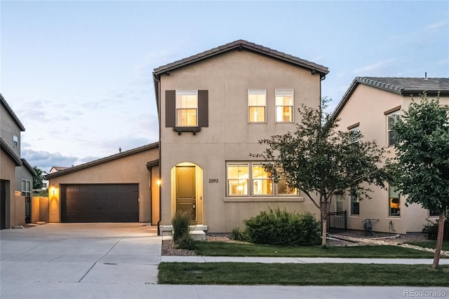 2592 S Norse Ct, Lakewood, CO 80228 - traditional-style house featuring concrete driveway, stucco siding, and an attached garage