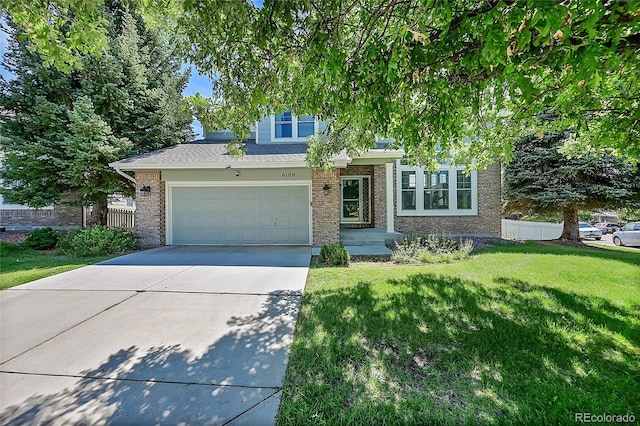 view of front facade featuring a garage and a front lawn