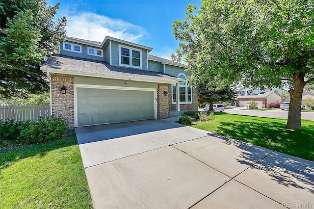 view of front of house featuring a garage and a front yard