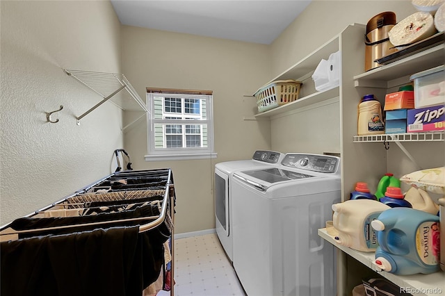 laundry area featuring independent washer and dryer and light tile patterned floors