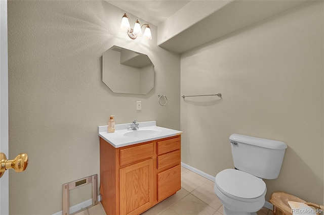 bathroom featuring tile patterned floors, toilet, and vanity