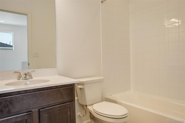 bathroom with shower / bathtub combination, vanity, and toilet