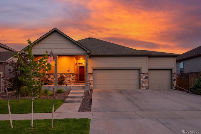 19468 E 65th Pl, Aurora, CO 80019 - view of front of house featuring a garage, stone siding, driveway, and a front yard