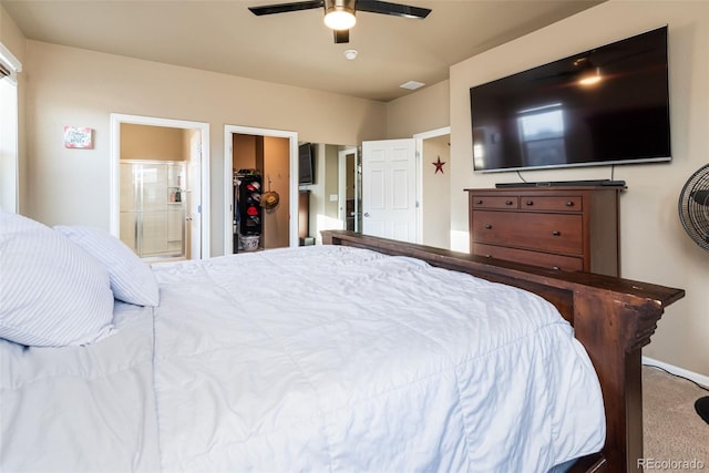 19468 E 65th Pl, Aurora, CO 80019 - carpeted bedroom featuring a walk in closet, ensuite bath, ceiling fan, a closet, and baseboards