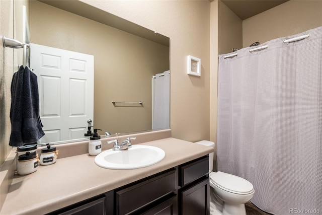 19468 E 65th Pl, Aurora, CO 80019 - bathroom with toilet, vanity, and a shower with curtain