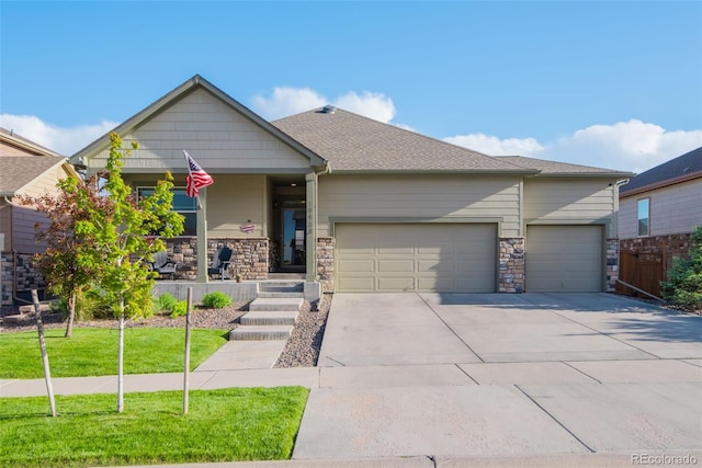 19468 E 65th Pl, Aurora, CO 80019 - view of front of home with a garage, concrete driveway, stone siding, and a porch