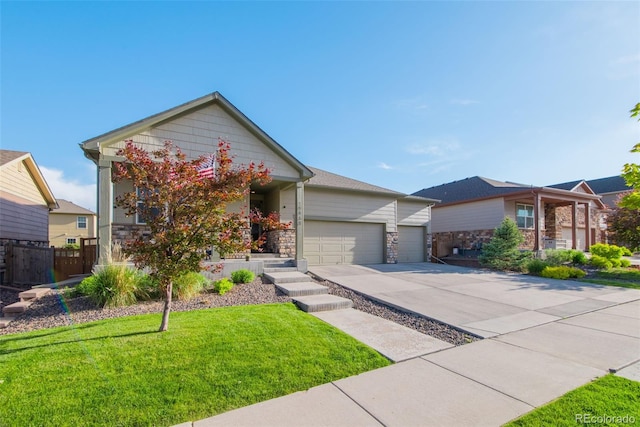 19468 E 65th Pl, Aurora, CO 80019 - view of front of home featuring a garage, driveway, and stone siding