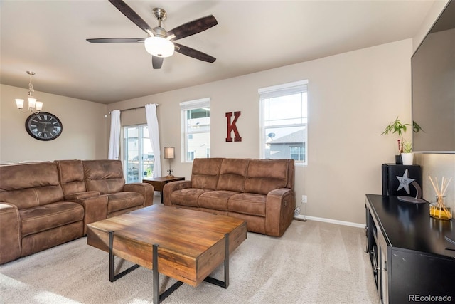 19468 E 65th Pl, Aurora, CO 80019 - living area featuring ceiling fan, light carpet, baseboards, and a chandelier
