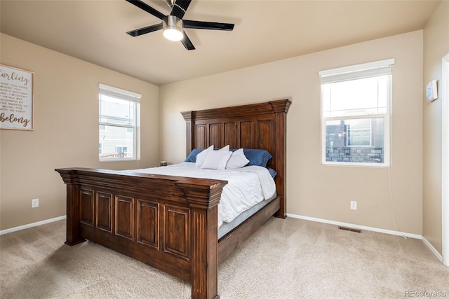 19468 E 65th Pl, Aurora, CO 80019 - bedroom with light colored carpet, baseboards, and a ceiling fan