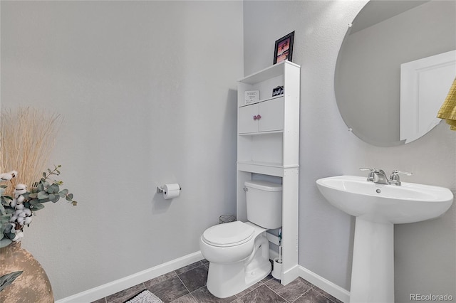 bathroom featuring tile patterned flooring, sink, and toilet