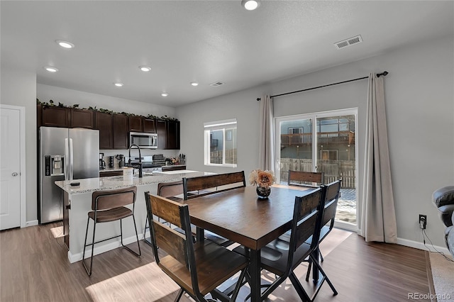 dining area featuring hardwood / wood-style flooring