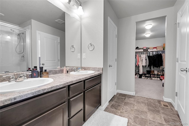 bathroom with vanity and an enclosed shower