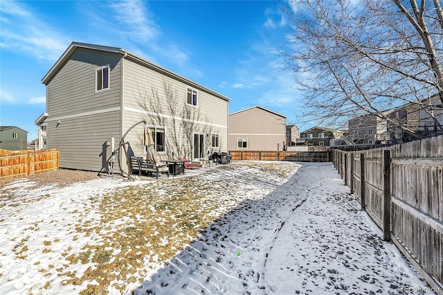 view of snow covered house