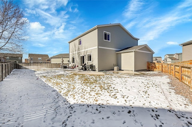 view of snow covered house