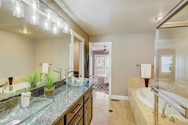 bathroom with visible vents, connected bathroom, a garden tub, tile patterned flooring, and vanity