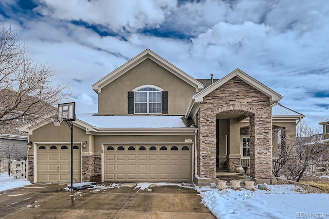 14096 Roaring Fork Cir, Broomfield, CO 80023 - view of front of house with stone siding, stucco siding, driveway, and a garage