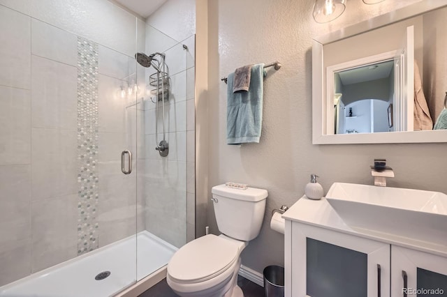 14096 Roaring Fork Cir, Broomfield, CO 80023 - full bathroom featuring a shower stall, vanity, and a textured wall