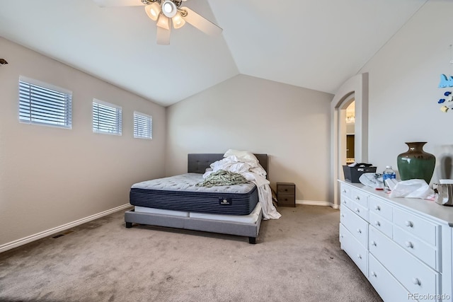 14096 Roaring Fork Cir, Broomfield, CO 80023 - carpeted bedroom featuring lofted ceiling, arched walkways, and ceiling fan