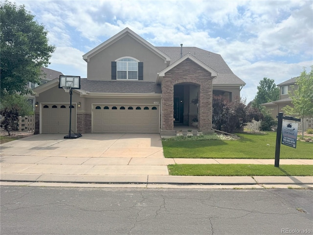 14096 Roaring Fork Cir, Broomfield, CO 80023 - traditional home with concrete driveway, stucco siding, a front lawn, and a garage