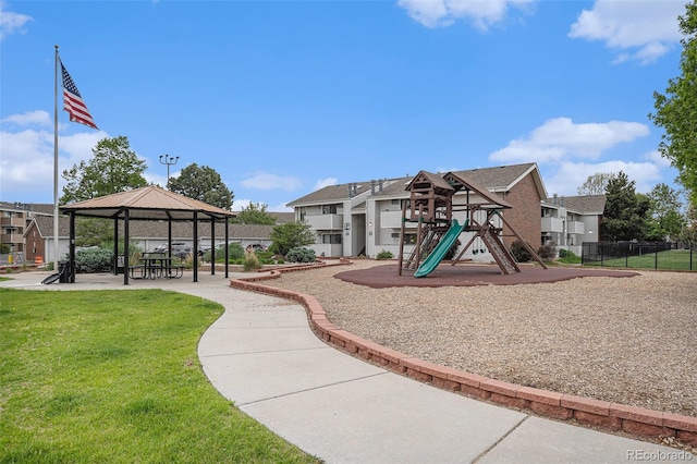 community jungle gym with a gazebo and a residential view