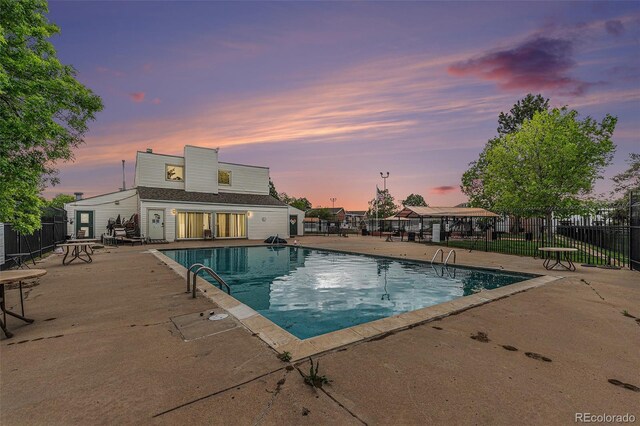 10150 E Virginia Ave Unit 7-304, Denver, CO 80247 - pool at dusk with a patio area