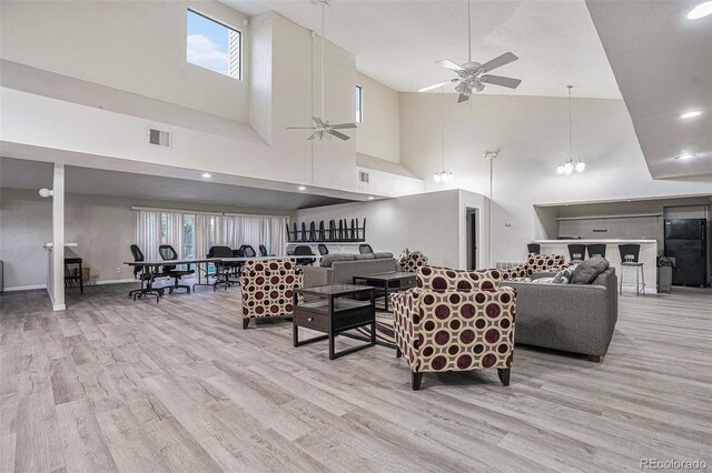 10150 E Virginia Ave Unit 7-304, Denver, CO 80247 - living room with ceiling fan, wood finished floors, high vaulted ceiling, and healthy amount of natural light