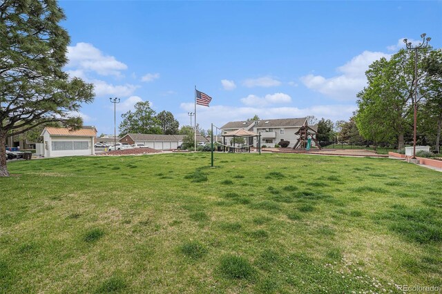 10150 E Virginia Ave Unit 7-304, Denver, CO 80247 - view of grassy yard with a playground