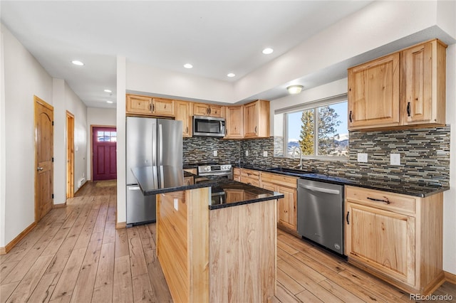 5844 Middle Fork Vis, Fairplay, CO 80440 - kitchen featuring appliances with stainless steel finishes, dark stone counters, light wood-style floors, light brown cabinets, and recessed lighting