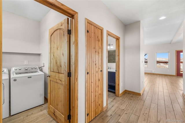 5844 Middle Fork Vis, Fairplay, CO 80440 - washroom featuring light wood-style floors, washer and dryer, and a baseboard heating unit