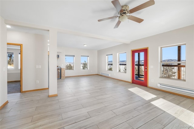 5844 Middle Fork Vis, Fairplay, CO 80440 - unfurnished living room with a baseboard heating unit, healthy amount of natural light, light wood-style flooring, and beam ceiling