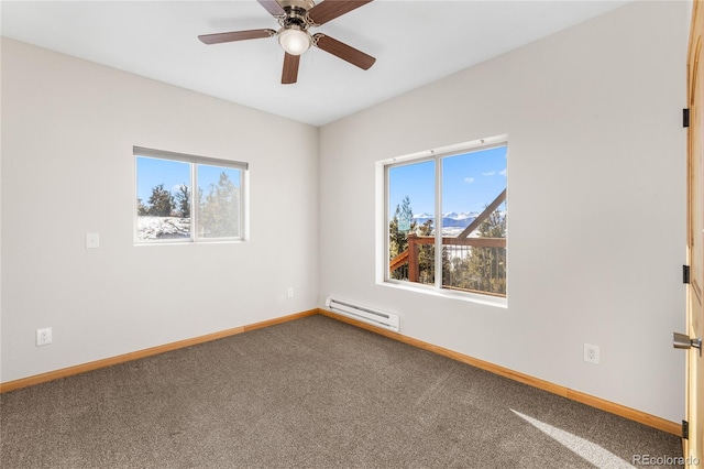 5844 Middle Fork Vis, Fairplay, CO 80440 - carpeted empty room with a baseboard heating unit, plenty of natural light, and ceiling fan