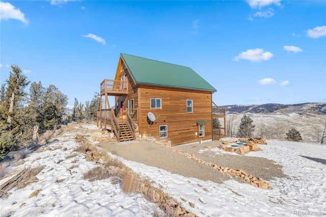5844 Middle Fork Vis, Fairplay, CO 80440 - snow covered property with a deck and stairway