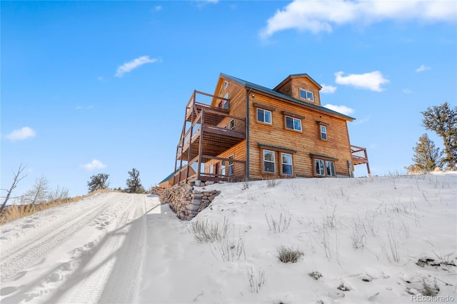 5844 Middle Fork Vis, Fairplay, CO 80440 - snow covered rear of property with a deck