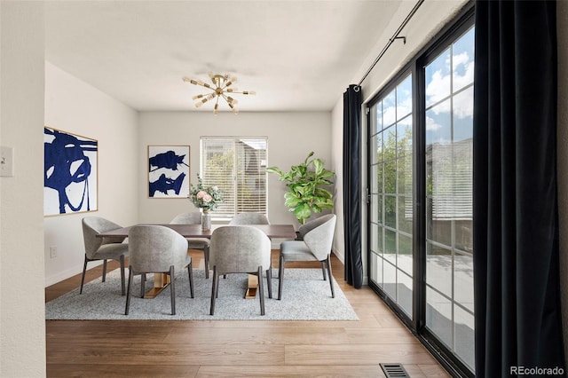 dining area featuring wood finished floors and baseboards