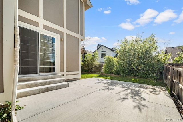 view of patio with a fenced backyard and entry steps