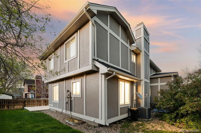 back of house featuring stucco siding