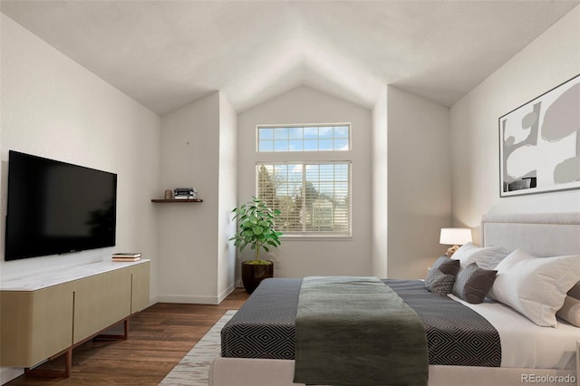 bedroom featuring lofted ceiling, dark wood-style floors, and baseboards